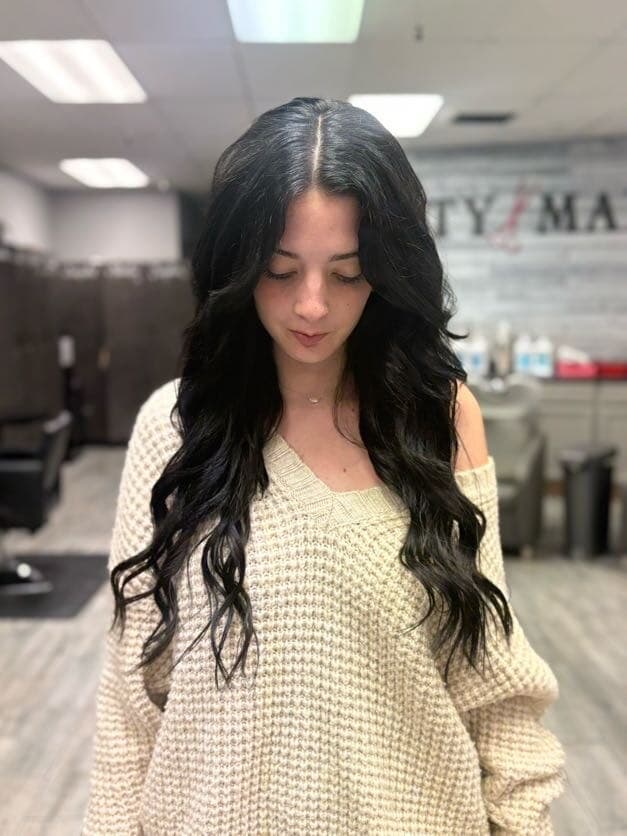 Long dark wavy hair extensions, front view